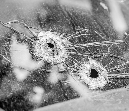 gun guns violence bullet holes